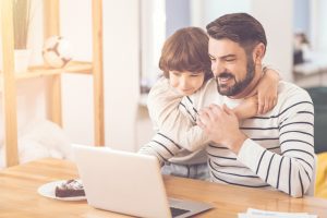 dad and son on computer searching for a divorce lawyer Chicago