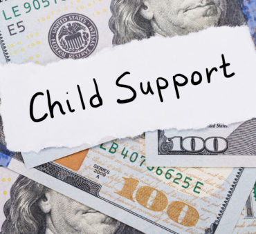 child support with money representing how our Chicago child support lawyers can help you with your child support case