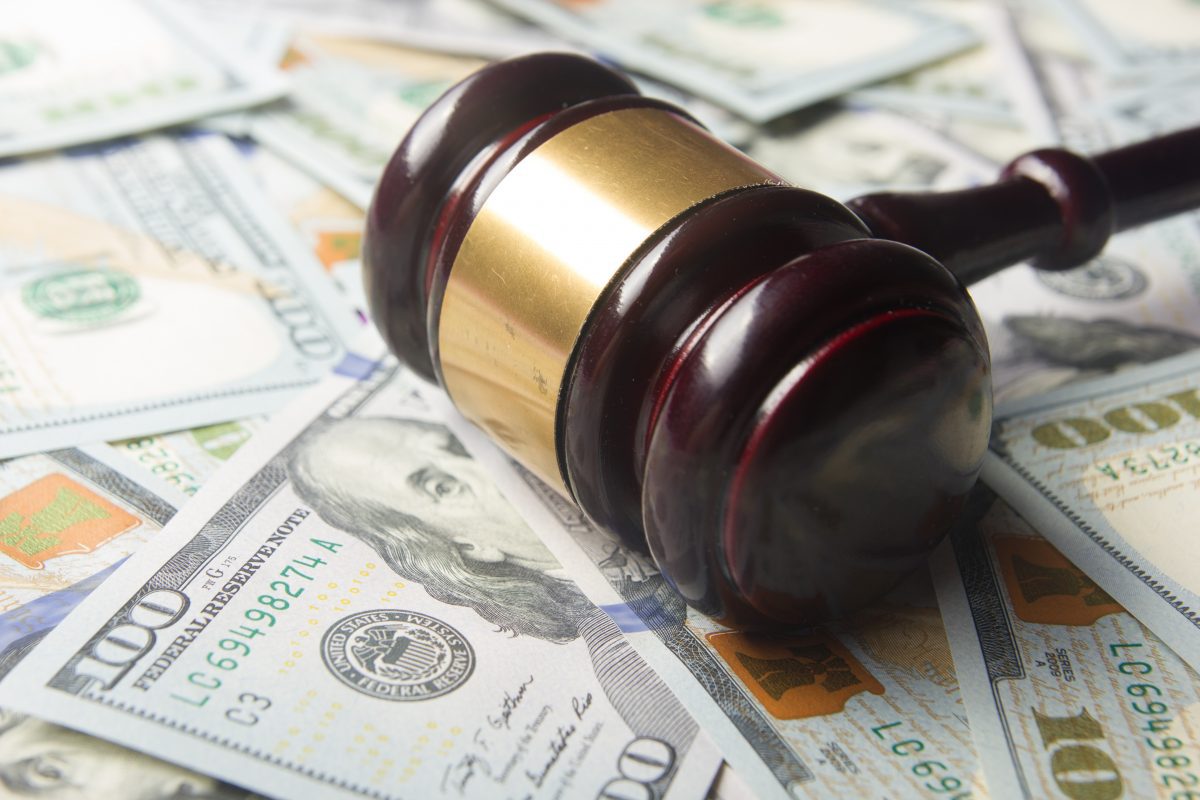 Gavel lays on top of money representing how a Chicago child support attorney can assist you with your case.
