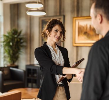 Welcoming Chicago divorce attorney shakes hands with client