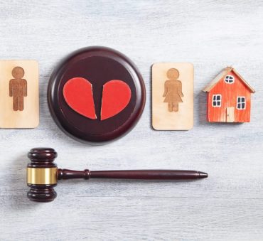 Broken heart with gavel for asset division with divorce concept when needing a Marital Property Division Lawyer Chicago.