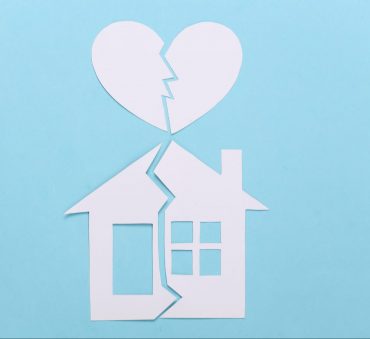 House model and heart that are broken in half to show Property Division Lawyer Chicago for help with marital assets.